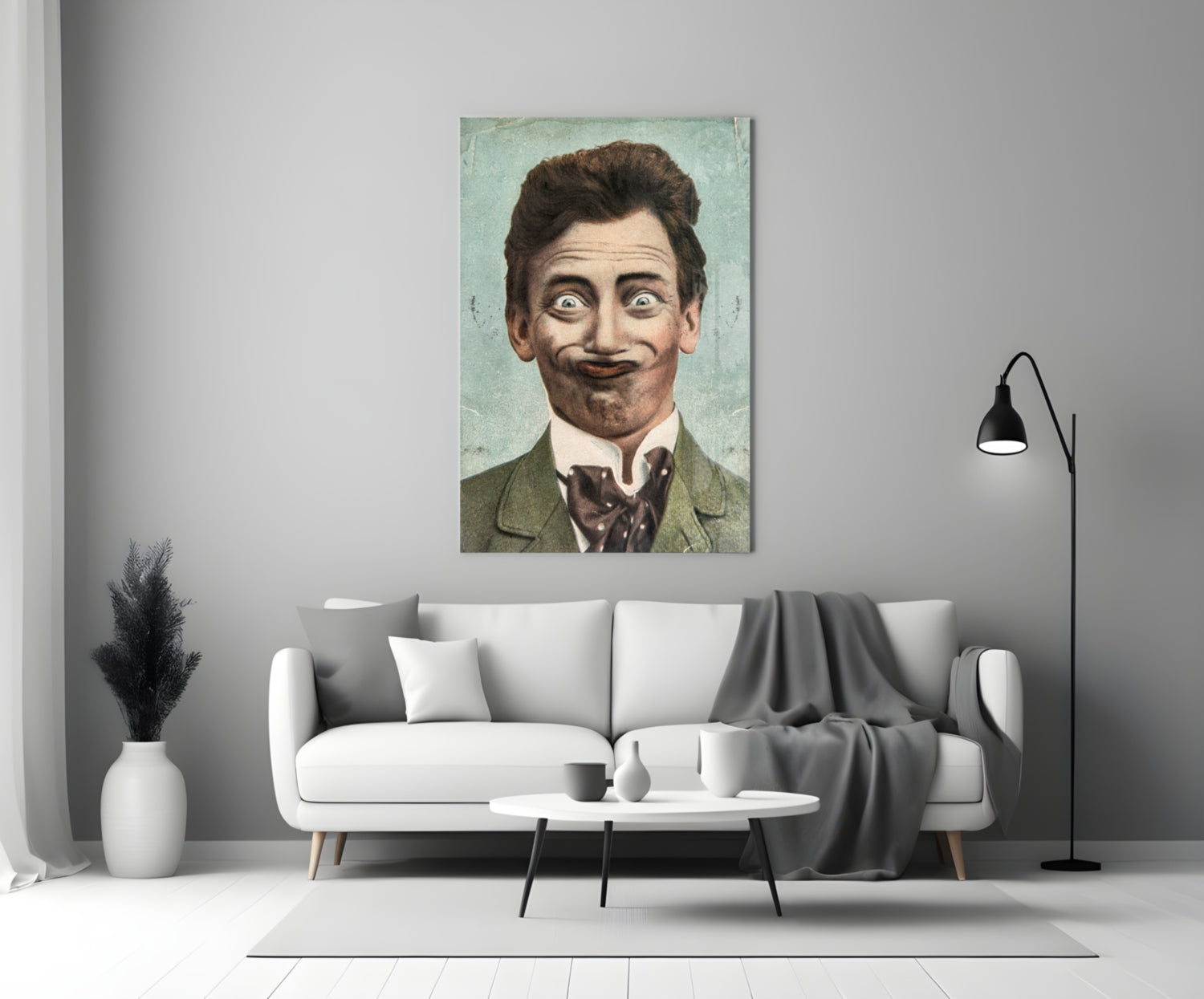 Gentleman Glass Wall Art displaying a vintage portrait of a man with dark hair and mustache wearing a green jacket, hung above a white sofa in a modern living room.