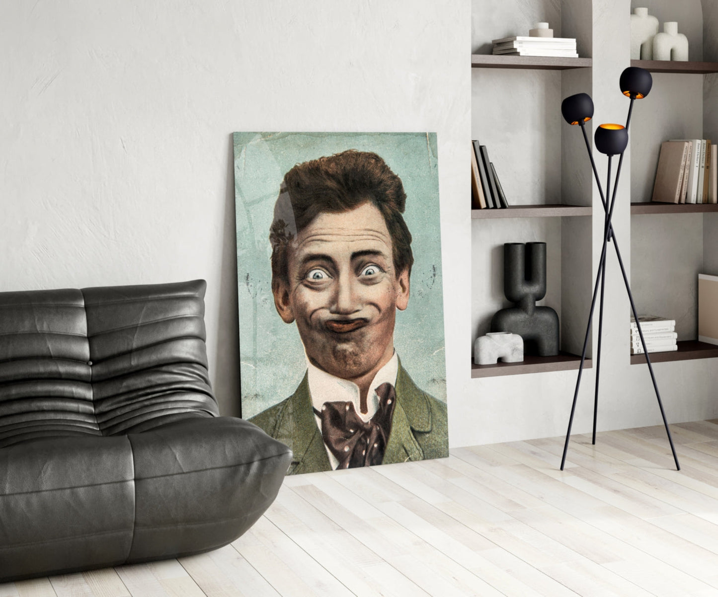 Vintage portrait of a man with exaggerated facial features displayed as glass wall art in a modern living room setting.