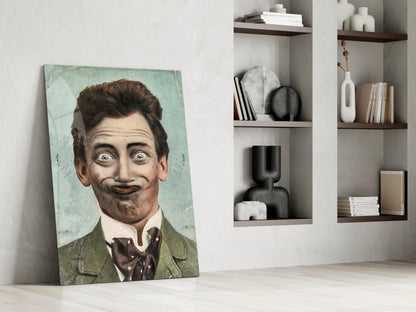 Vintage portrait glass art leaning against white wall beside shelving unit displaying decorative objects and books.