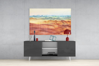 Abstract Mountains Glass Wall Art displayed above a dark gray media console with white legs, showing warm desert tones and layered peaks.