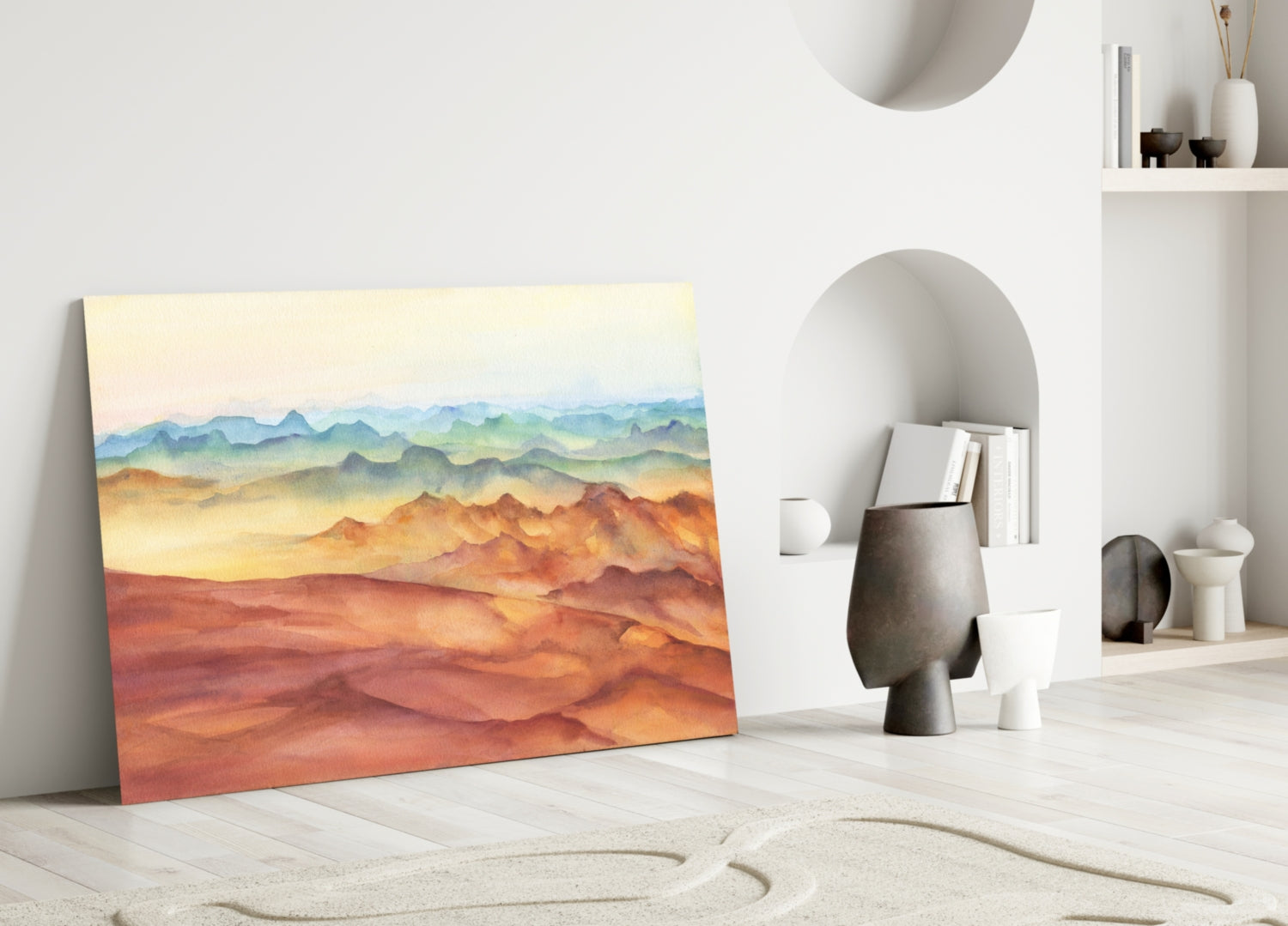 Abstract Mountains Glass Wall Art leaning against white wall in minimalist room setting with warm sunset colors.