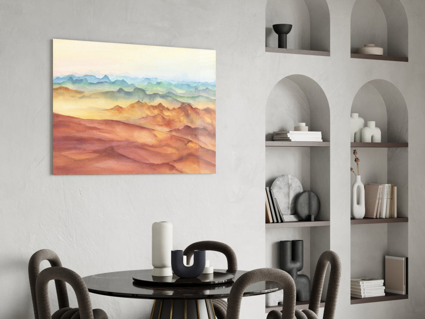 Abstract mountain landscape glass wall art in warm earth tones displayed above a dining table in a modern interior.
