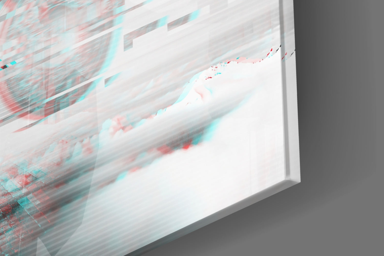Angled close-up of glass wall art with red and cyan abstract streaks on white background, showing beveled edge detail.