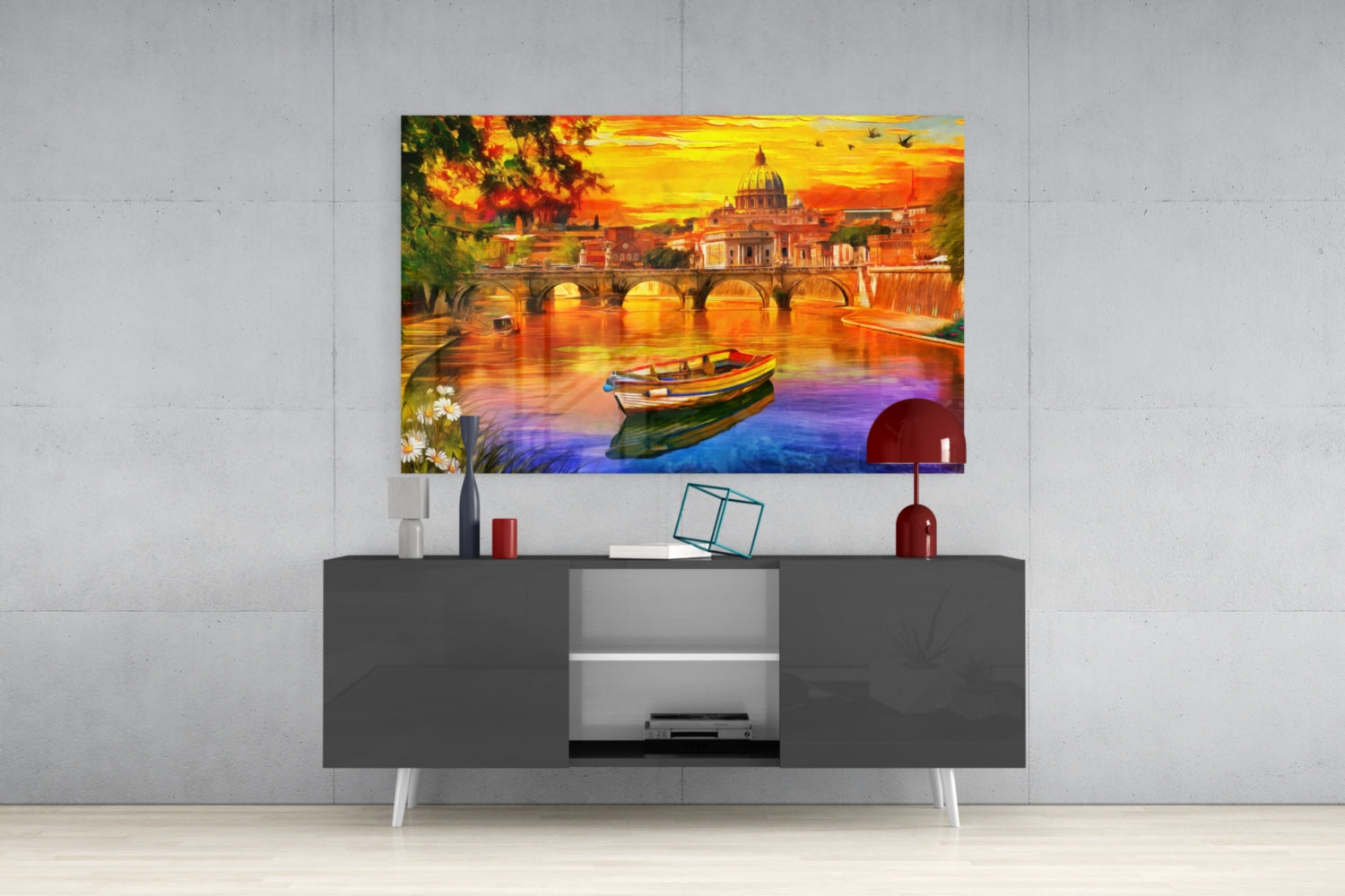 Colorful glass wall art depicting Rome's St. Peter's Basilica at sunset displayed above a modern gray TV console.