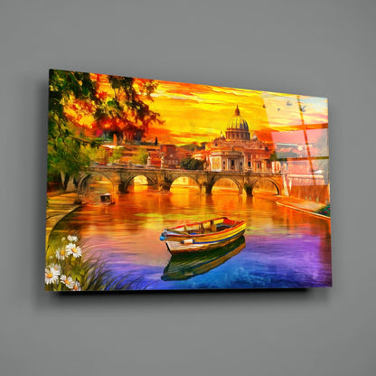 Glass wall art depicting St. Peter's Basilica at sunset with colorful boats on water, displayed at an angle against gray wall.