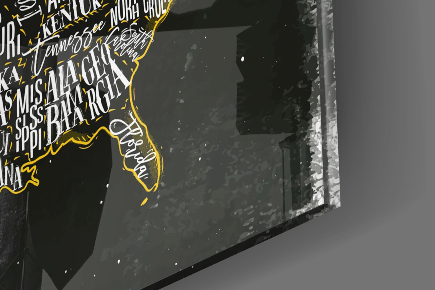 Close-up detail of glass wall art showing yellow-outlined USA map with white text on dark background, angled perspective view.