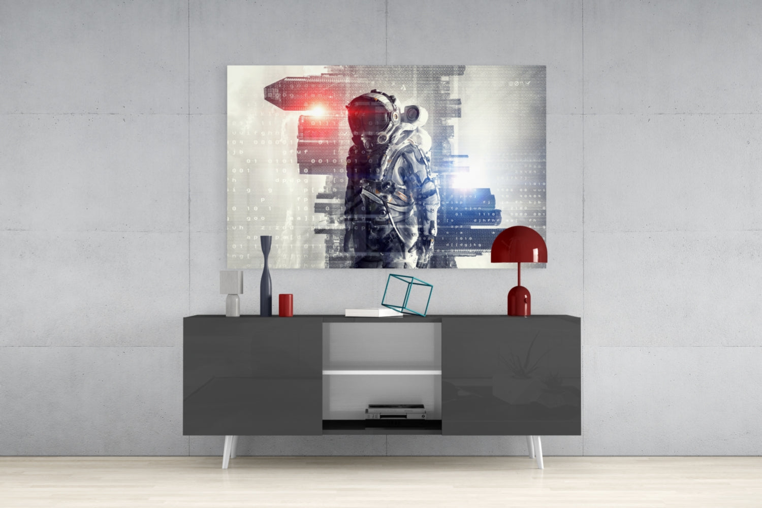 Digital Astronaut Glass Wall Art displayed above dark gray media console with red and white decorative accessories in modern living room setting.