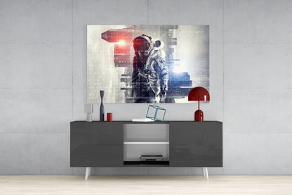 Digital Astronaut Glass Wall Art displayed above dark gray media console with red and white decorative accessories in modern living room setting.