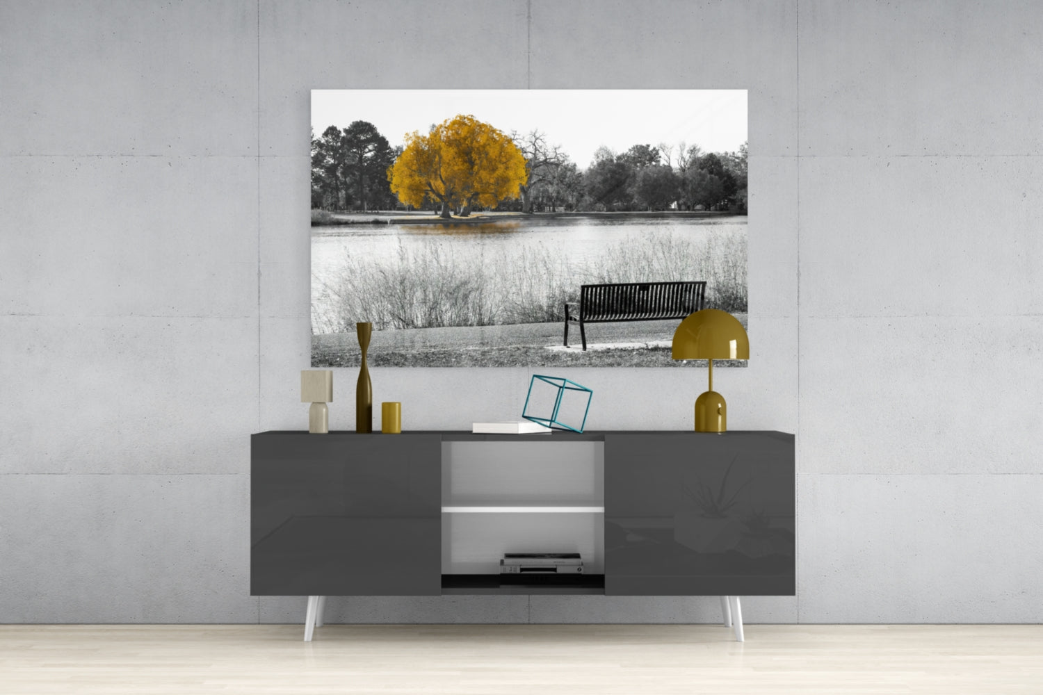 Yellow Tree Glass Wall Art displayed above a dark gray media console showing a serene landscape with golden tree and bench by water.
