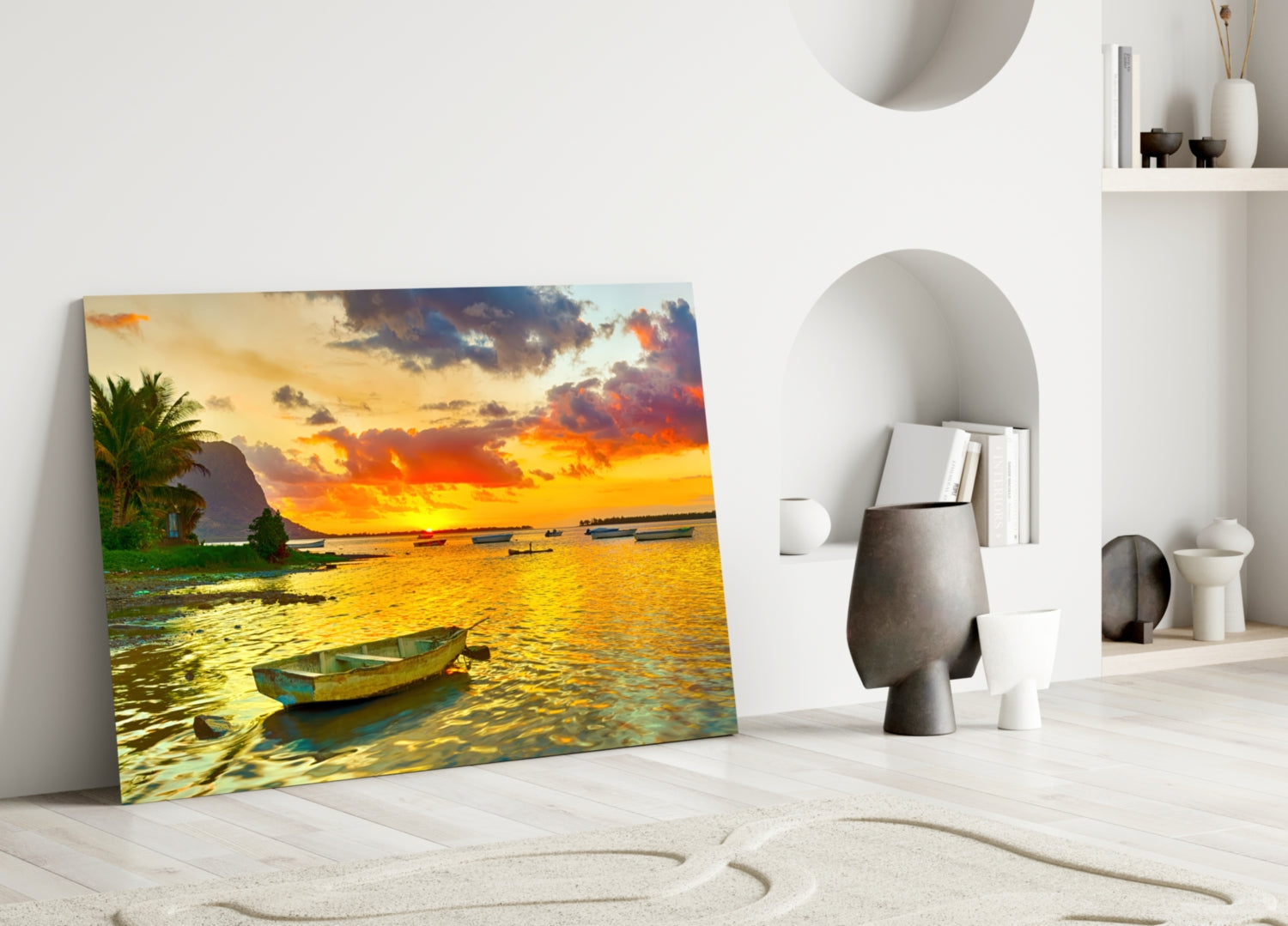 Canvas print of golden sunset over water with fishing boats leaning against white wall in minimalist room.