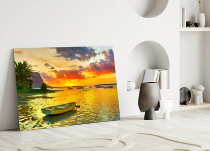 Canvas print of golden sunset over water with fishing boats leaning against white wall in minimalist room.