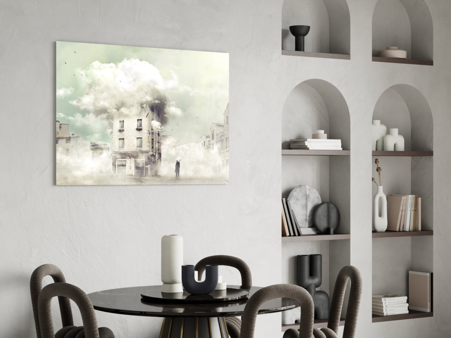 Fog glass wall art depicting a misty urban street scene with a burning building displayed above a dining table in a minimalist interior.