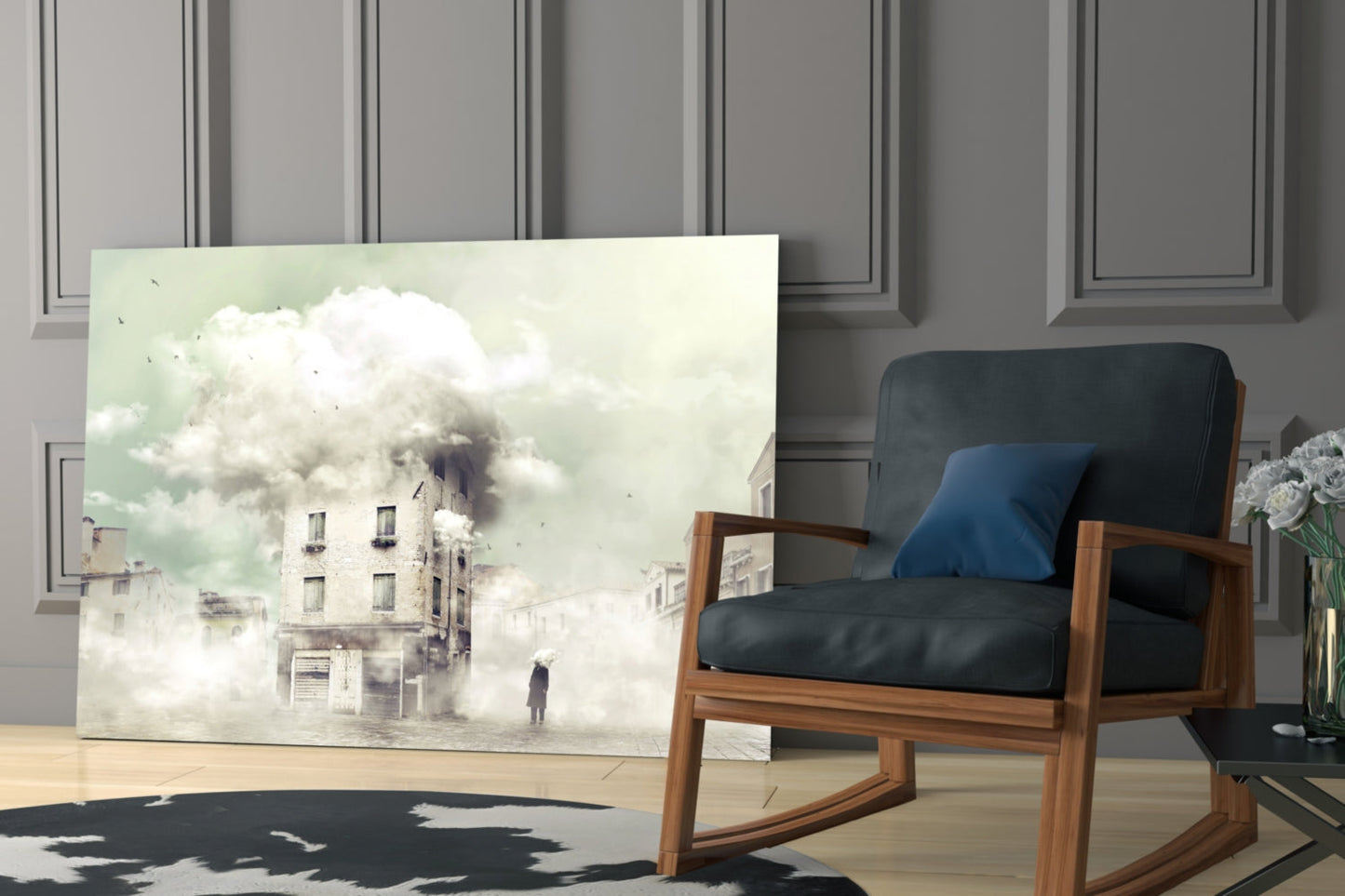 Glass wall art depicting a surreal foggy urban scene with a solitary figure and ethereal clouds, displayed in a modern interior with mid-century wooden chair.