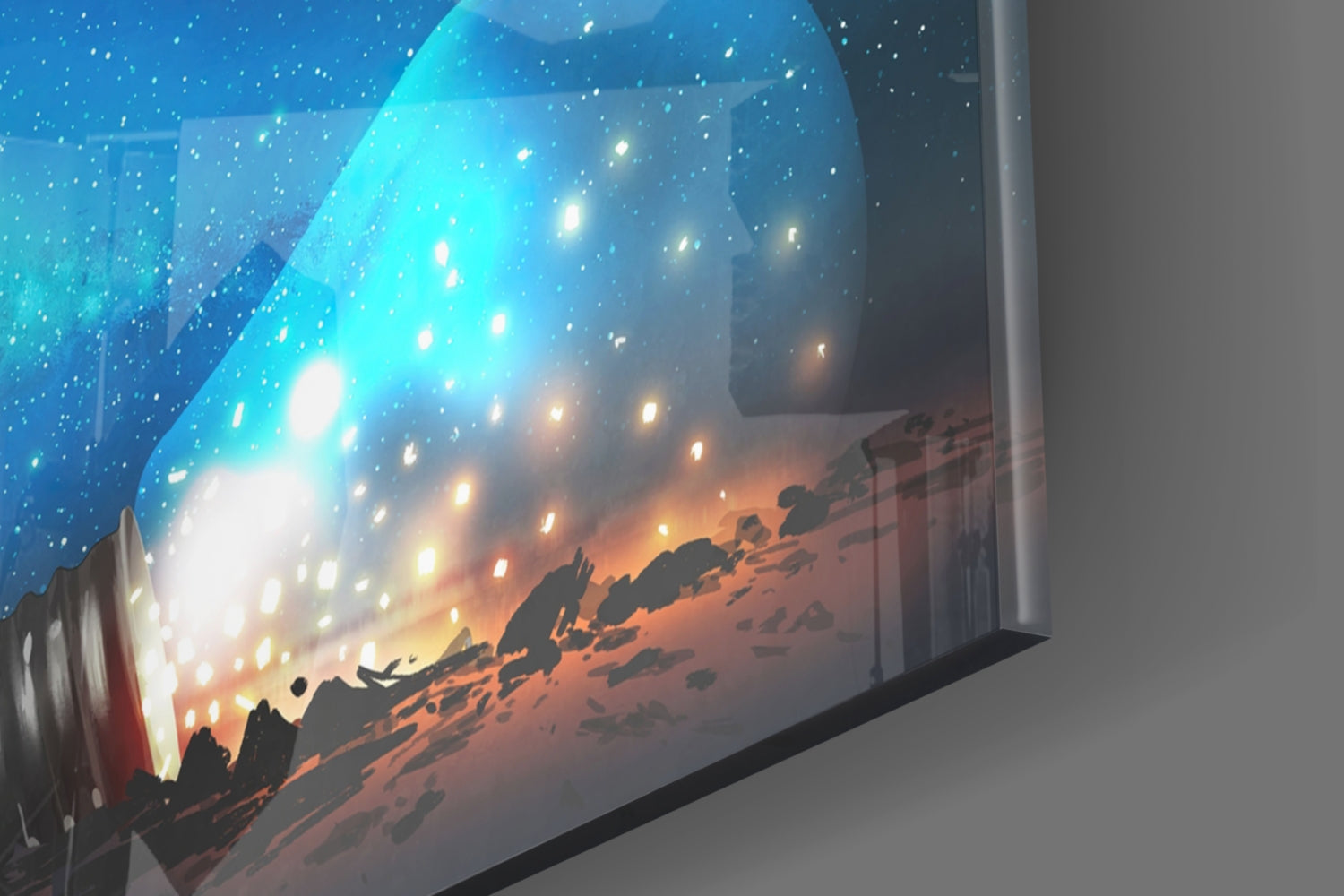 Angled view of glass wall art displaying a starry night sky transitioning to a desert sunset landscape with silhouetted figures.