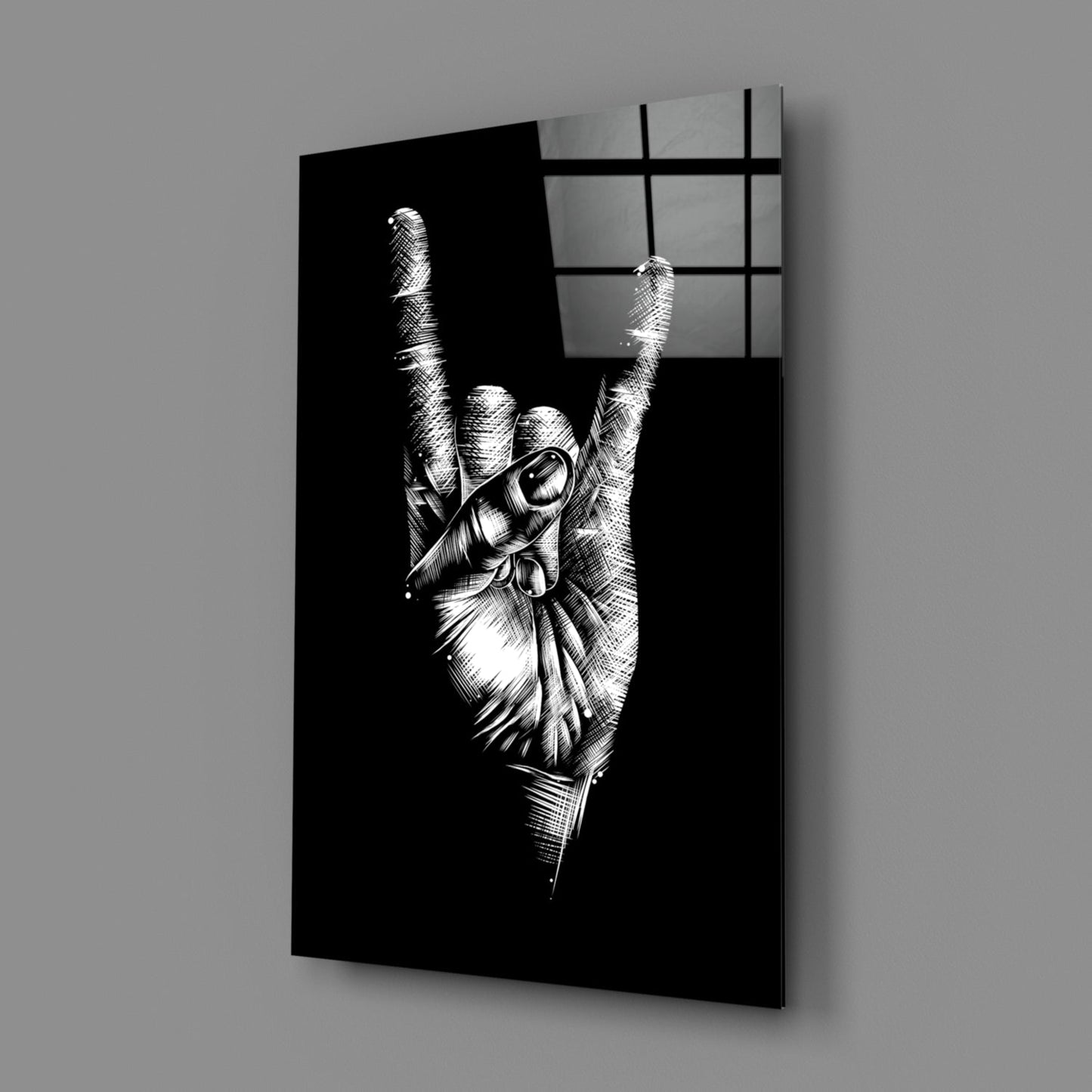 Black glass wall art panel displaying a detailed white line drawing of a hand making a rock horns gesture, angled perspective view.
