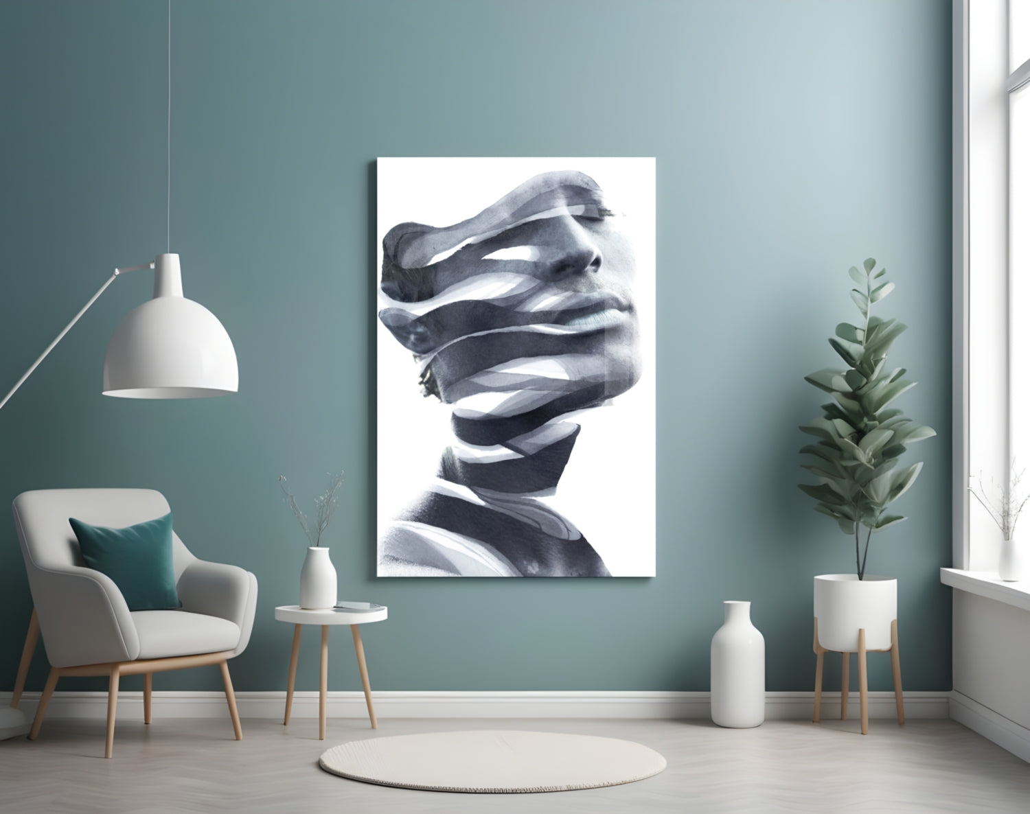 Black and white portrait artwork displayed on a teal wall above a white chair in a modern living room setting.