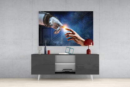 Modern living room setup featuring a glass wall art panel displaying an astronaut and human hand touching with a glowing light, mounted above a dark gray media console with white legs.