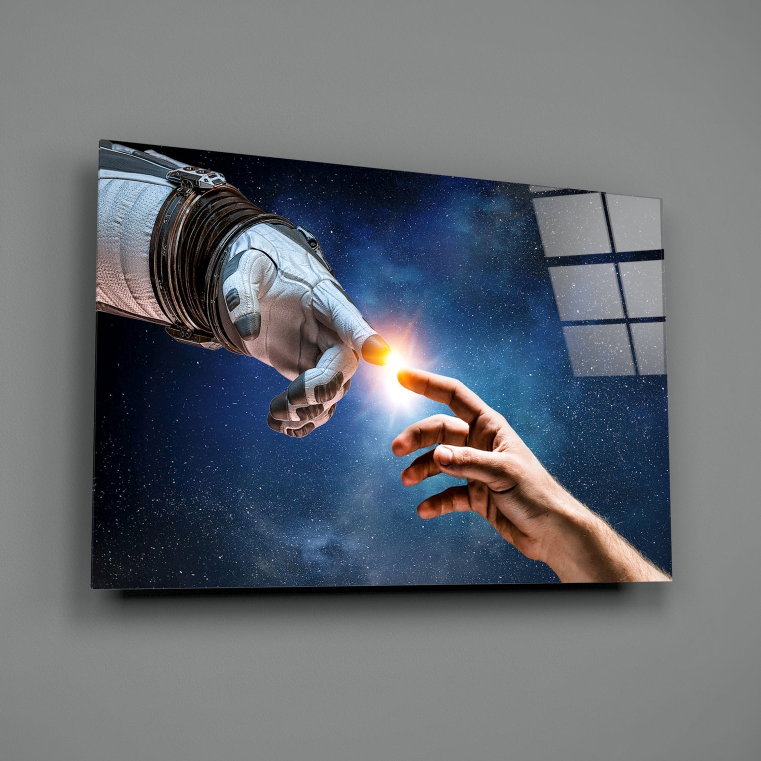 Astronaut gloved hand touching human hand against starry space backdrop on mounted glass wall art panel.