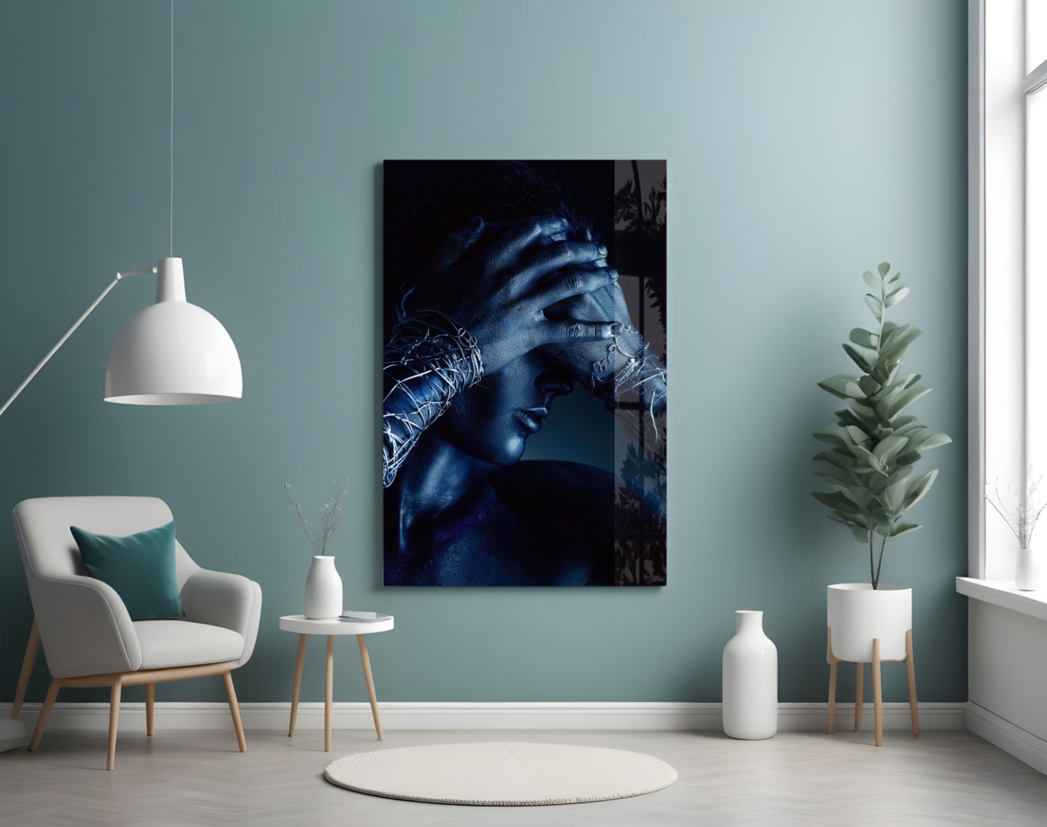 Deep Thought Glass Wall Art displayed on a sage green wall above a white armchair in a minimalist living room setting.