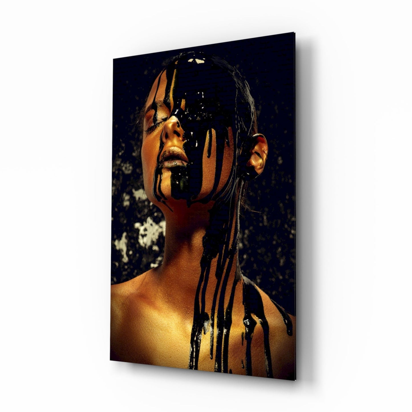 Portrait of a person with gold and black paint dripping down face against dark background, displayed as wall-mounted panel.