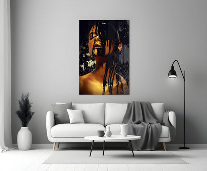 Portrait stained glass wall art depicting a woman's face in golden and black tones, displayed above a white sofa in a modern living room.