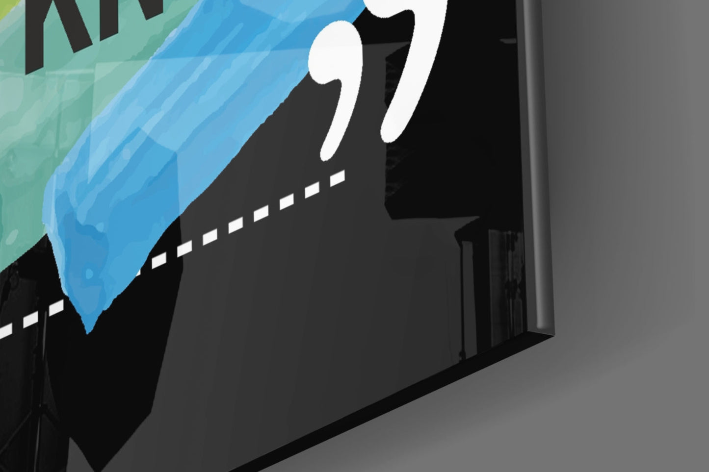 Close-up angled view of glass wall art showing silhouetted figure with white hand and blue swoosh design against black background.