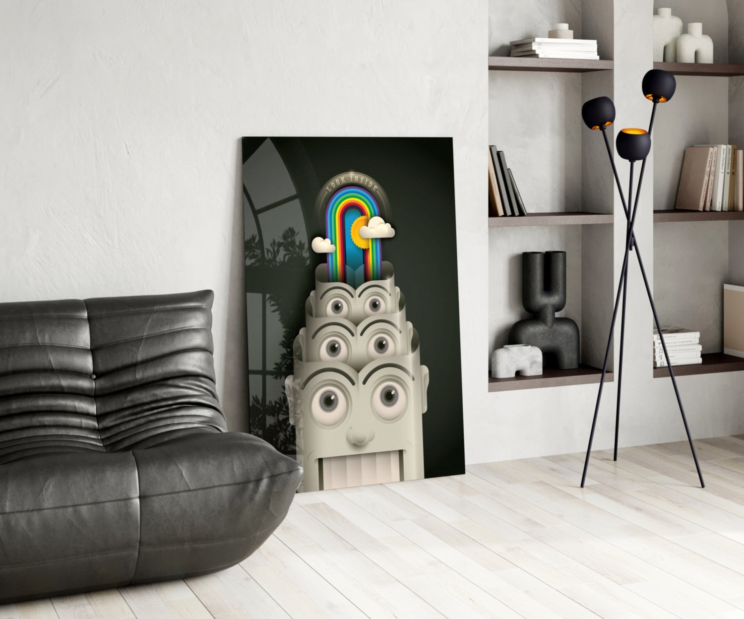Rainbow Machine glass wall art leaning against wall in modern living room with black sofa and shelving.