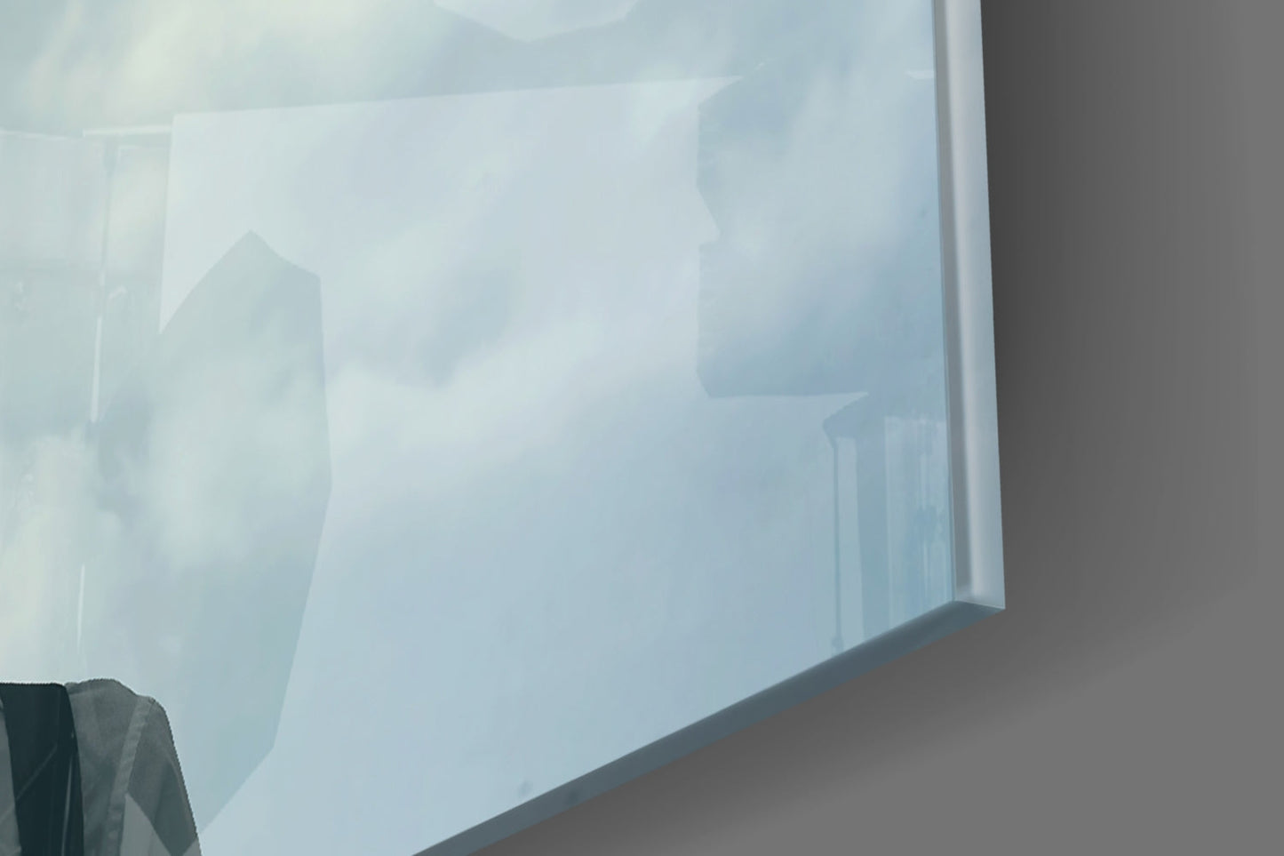 Frosted glass wall art panel mounted indoors showing translucent silhouettes of balloon-headed figures against soft blue-white tones.