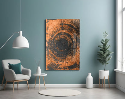 Copper spiral swirl glass wall art displayed on teal wall above white chair in modern living room setting.