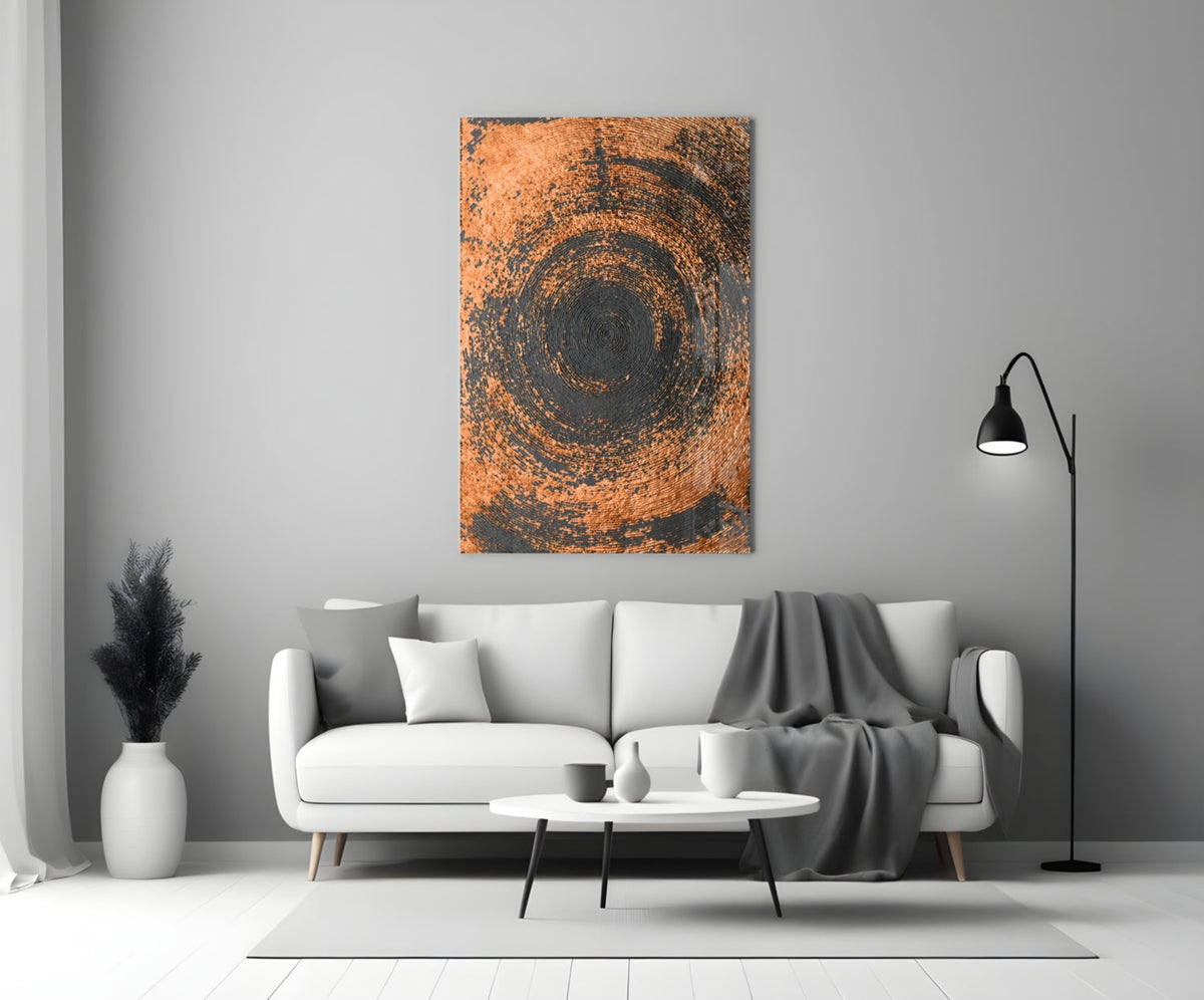 Copper Spiral Swirl Glass Wall Art displayed above a white sofa in a minimalist living room setting with gray accents.