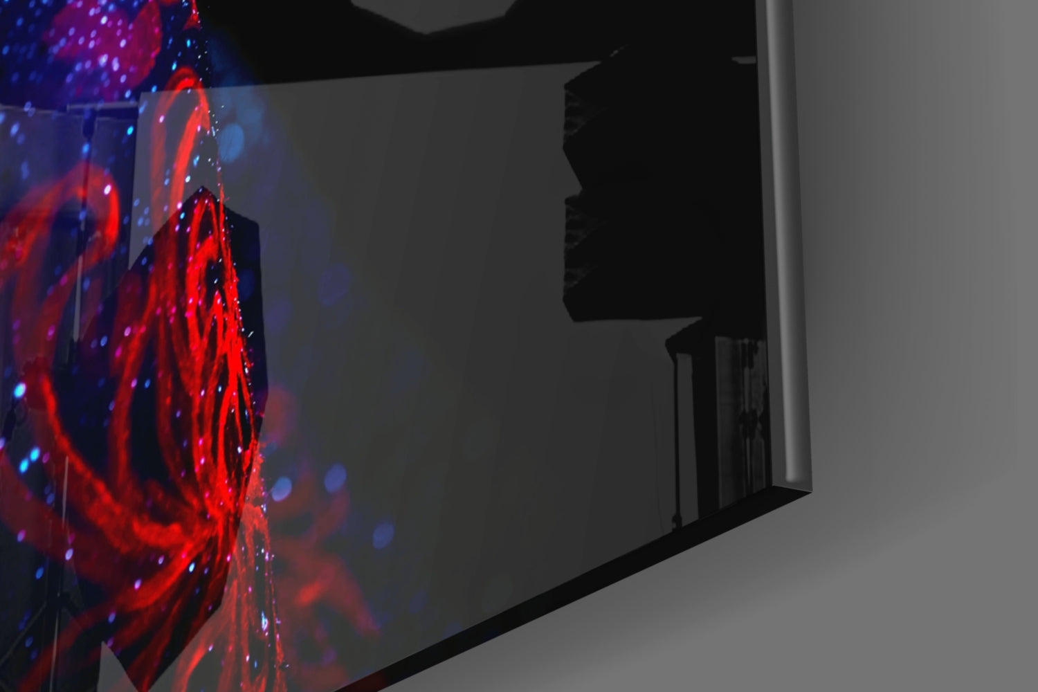Serenity Glass Wall Art displayed on a room wall, showing red and blue glowing light patterns against dark background.