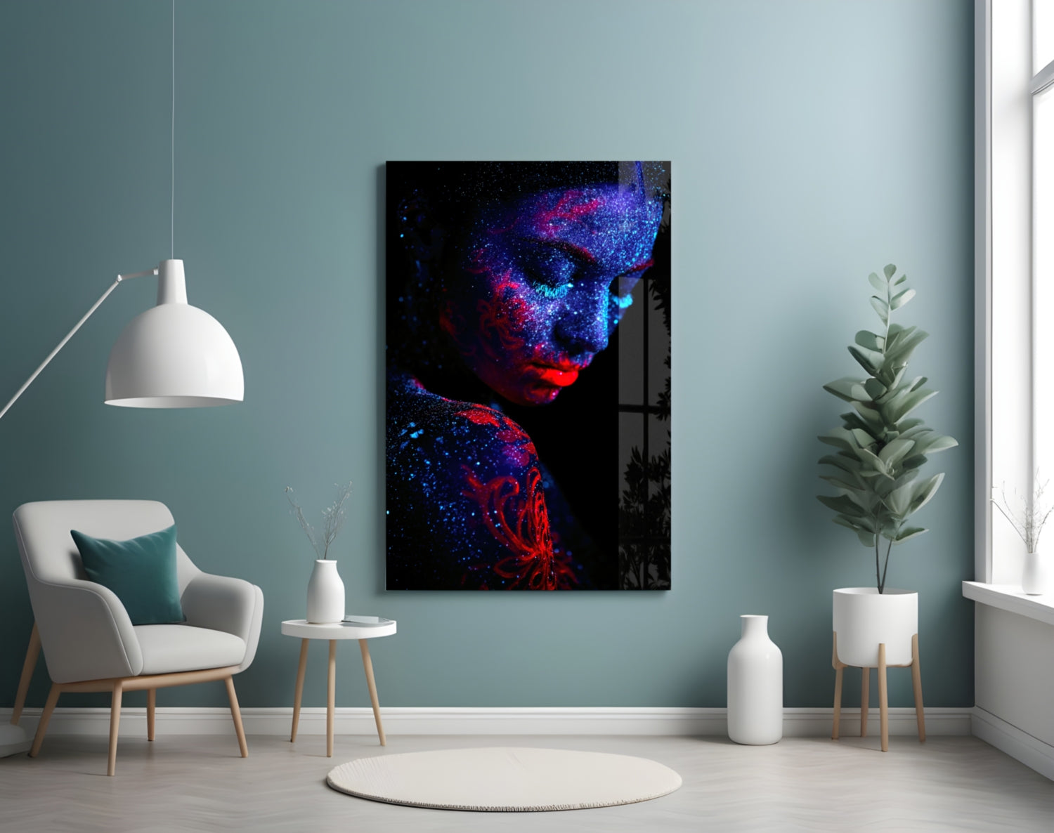 Modern interior room with neon-lit portrait glass art displaying blue and red glowing face against teal wall.