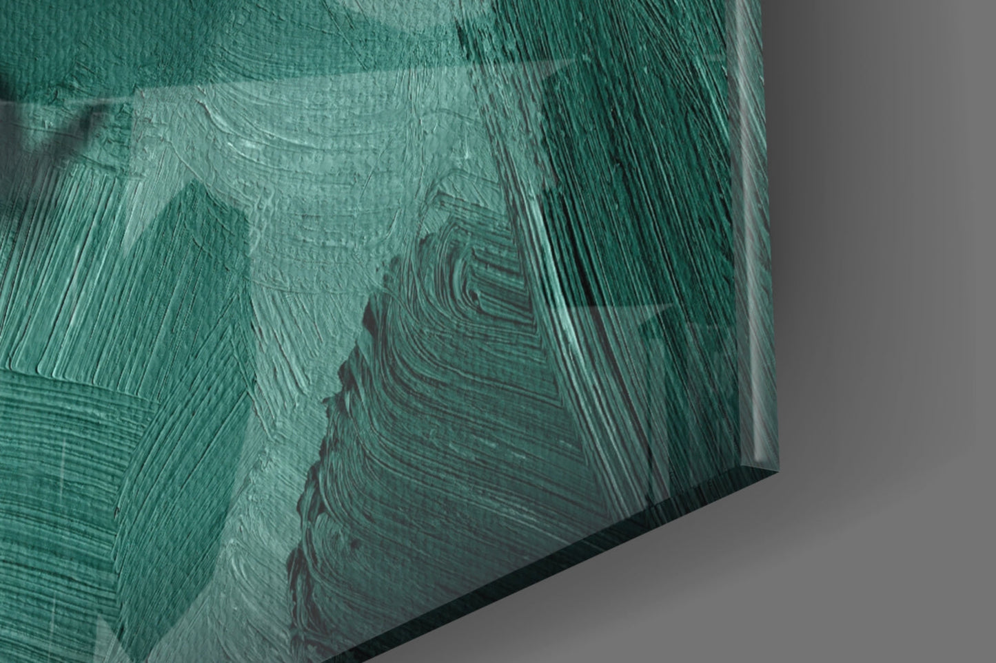 Close-up angled view of textured green glass wall art with layered brushstroke patterns and dark striations.