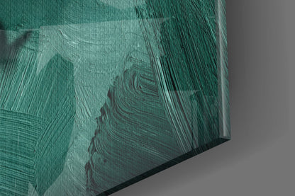 Close-up angled view of textured green glass wall art with layered brushstroke patterns and dark striations.