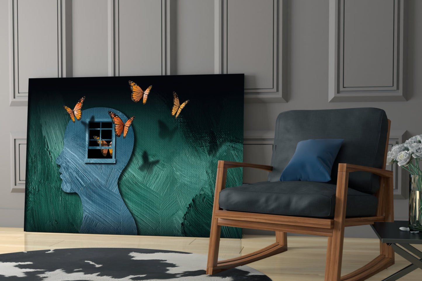 Glass wall art displaying a blue profile silhouette with window and orange butterflies on green textured background, displayed in modern living room setting.