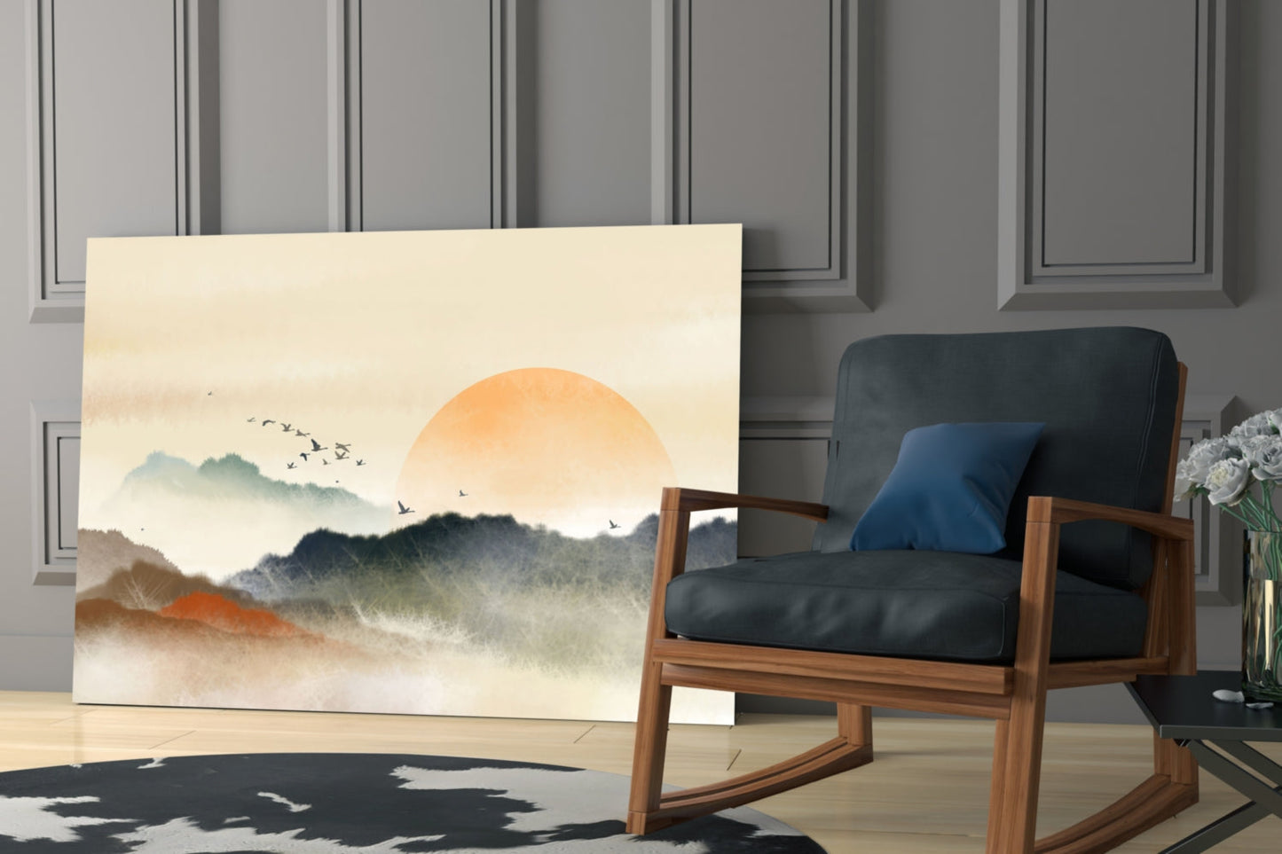 Abstract landscape glass wall art depicting misty mountains and orange sun displayed in modern living room setting with wooden chair.