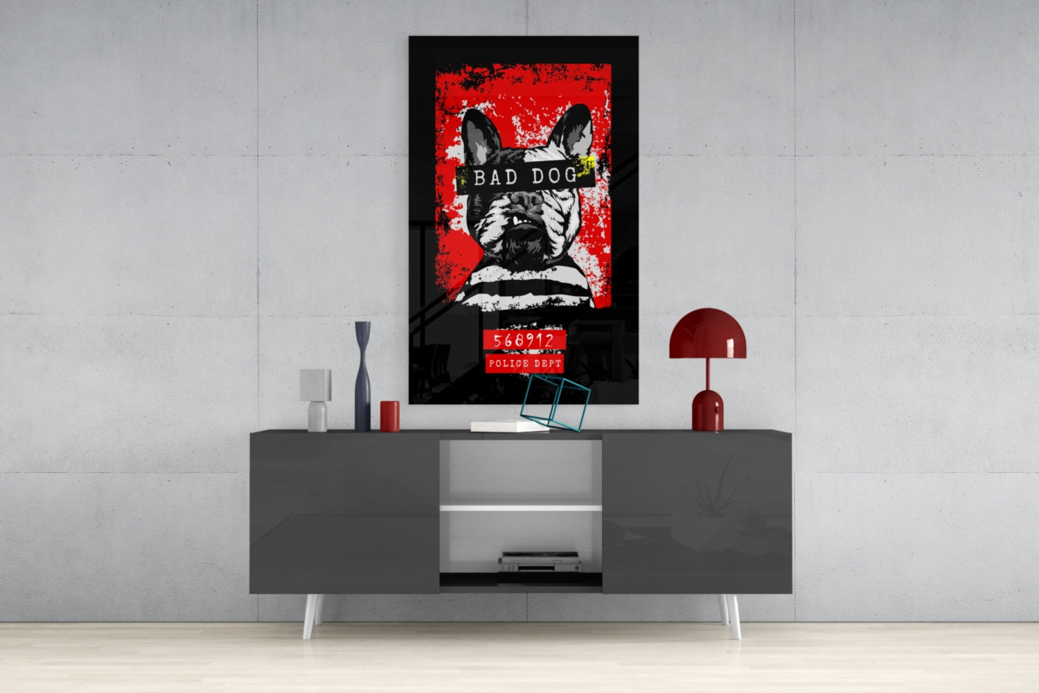 Bad Dog" glass wall art featuring a French Bulldog mugshot with red background and police department text, displayed above gray media console in modern interior setting.