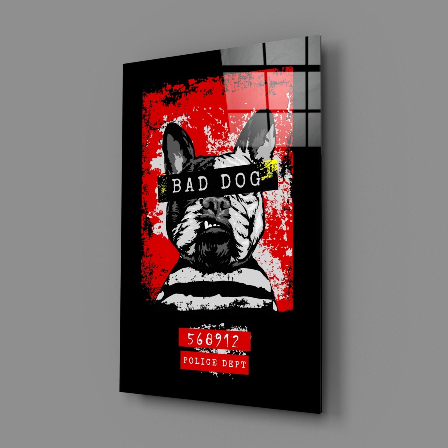 Angled perspective view of black glass wall art featuring a stylized French Bulldog mugshot with red background, "Bad Dog" text, and police identification number.