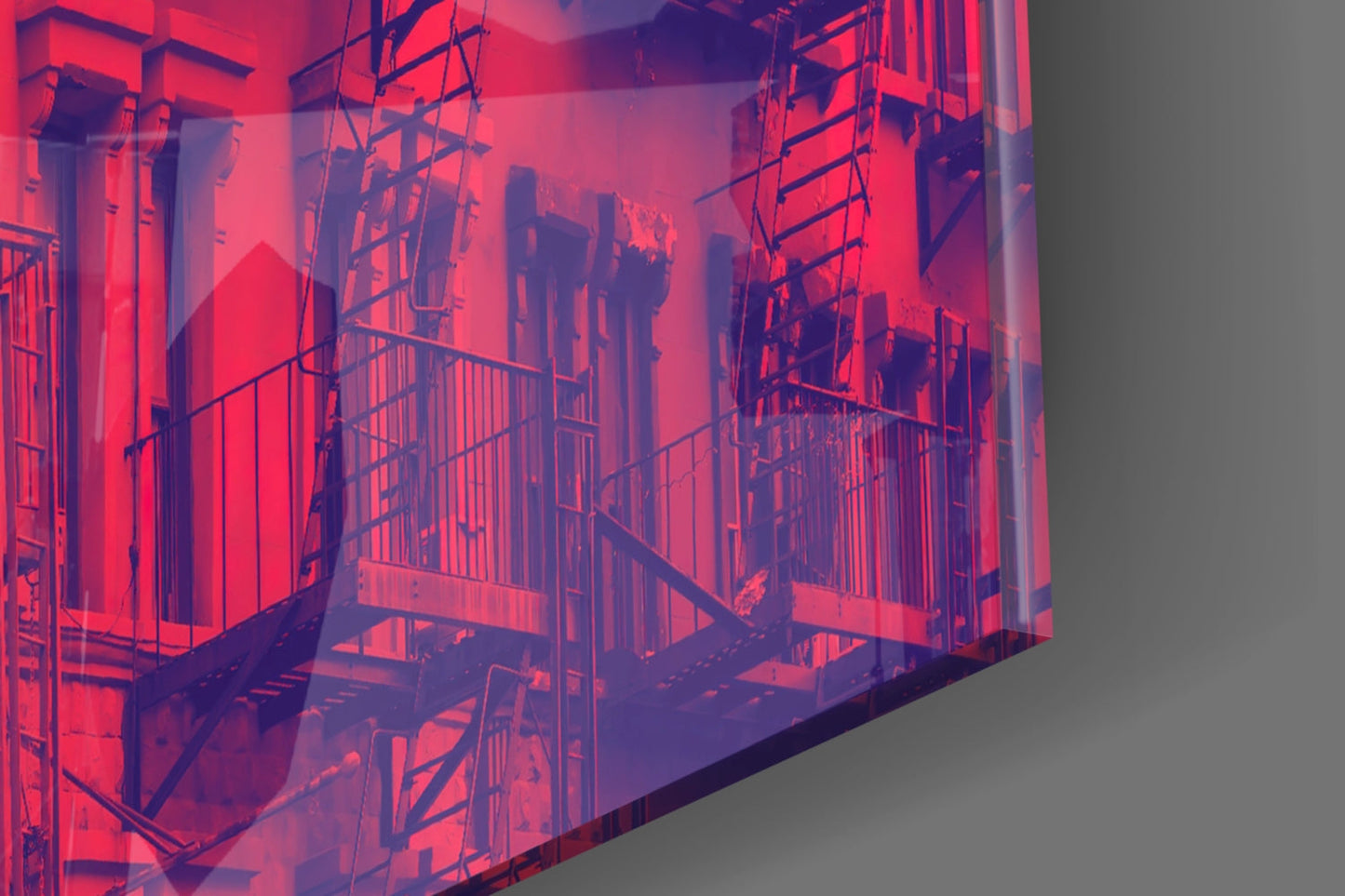 Isometric architectural glass wall art showing red-lit building facade with scaffolding and metal railings against gray background.