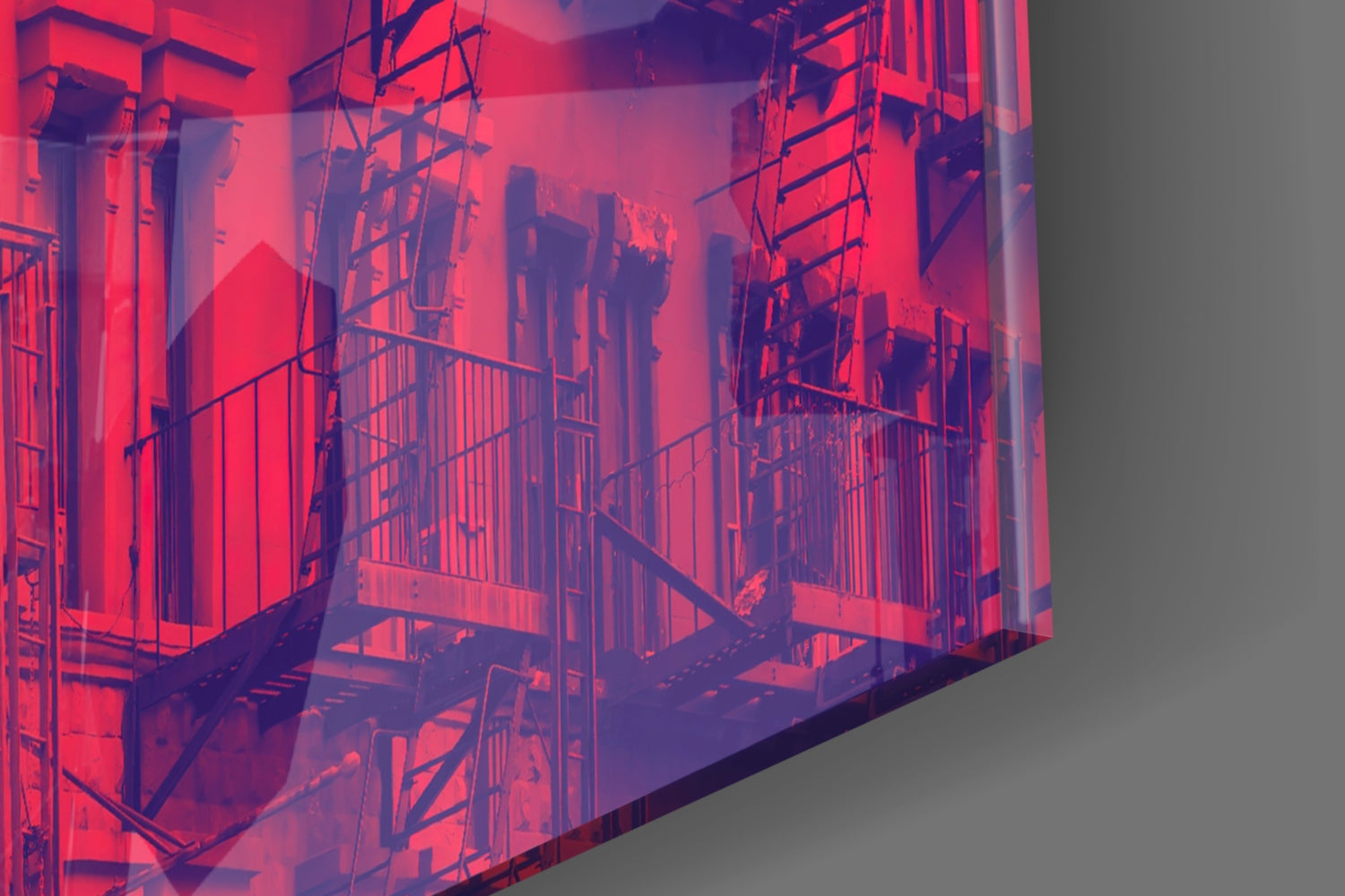 Isometric architectural glass wall art showing red-lit building facade with scaffolding and metal railings against gray background.