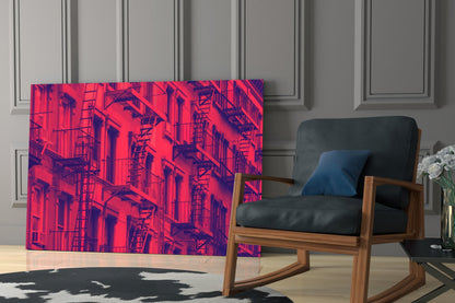 Vibrant red and purple neon-style glass wall art depicting urban fire escapes displayed in modern living room setting.