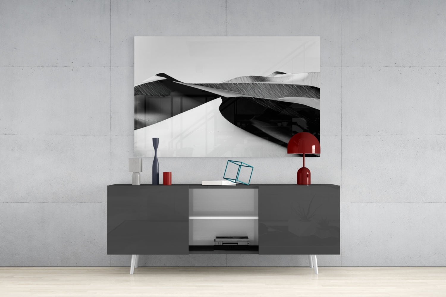 Black and white glass landscape artwork displayed above a dark gray media console with red decorative accents.
