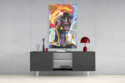 Colorful pop art portrait of a woman with yellow headwrap and large gold earrings displayed above a modern gray media console.