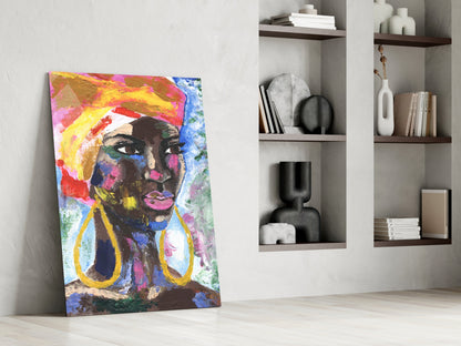 Colorful pop art portrait of a woman with yellow halo and gold earrings leaning against white wall beside wooden shelving.