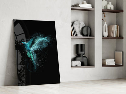 Luminous Parrot Glass Wall Art leaning against white wall beside styled shelving with decorative objects and books.