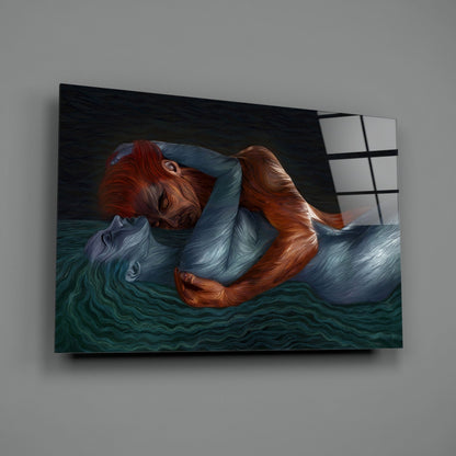 Glass wall art mounted on gray wall showing illustrated figure with red hair in blue clothing floating in teal water.