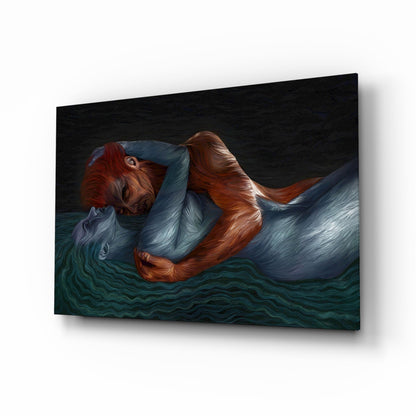 Glass wall art featuring a figure with reddish-brown hair in blue clothing floating in dark teal water against black background.
