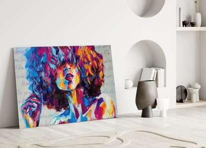 Colorful pop art portrait canvas leaning against white wall in minimalist interior with decorative objects.