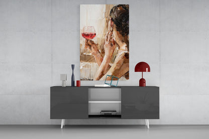 Contemporary portrait painting of woman holding red wine glass, displayed above dark gray media console in modern interior setting.