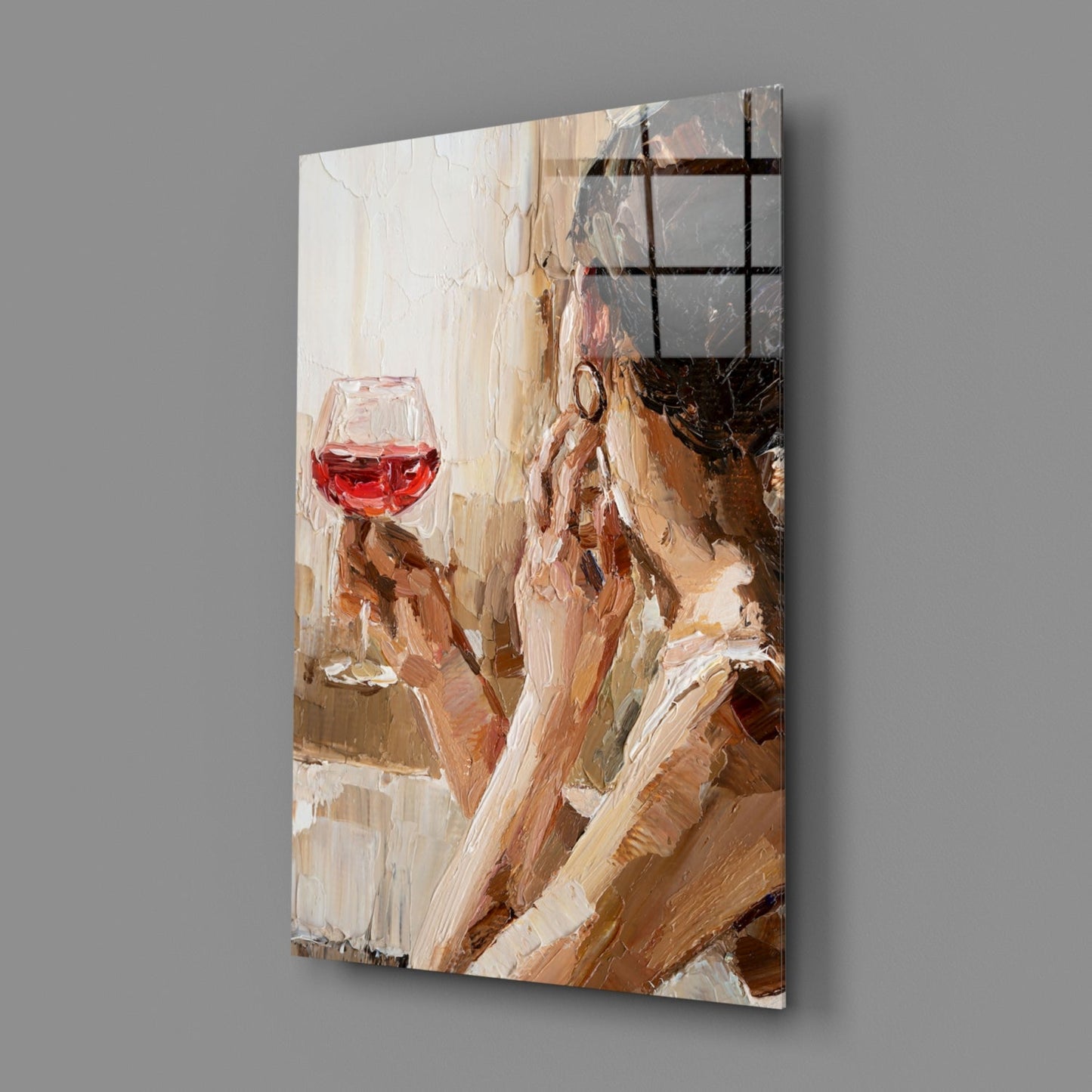 Angled view of glass art panel showing woman with red wine glass against warm beige and brown brushstroke background with black grid overlay.